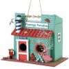 A whimsical flamingo themed bird house to attract our nesting feathered friends