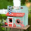 A whimsical flamingo themed bird house to attract our nesting feathered friends