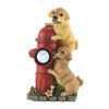 Puppy figurines mounting a fire hydrant – solar powered